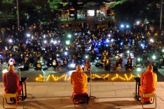 1.-3-monks-praying-with-crowd-3